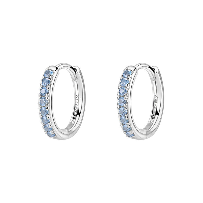 Silver hoop earrings with blue gemstones on a white background