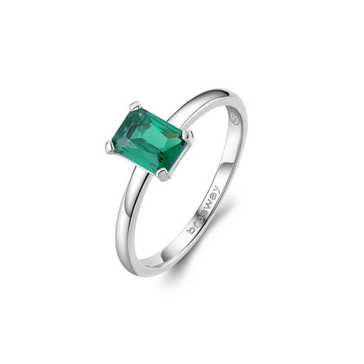 Silver ring with a green gemstone on a white background