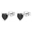 Heart-shaped black gemstone earrings with silver posts on a white background