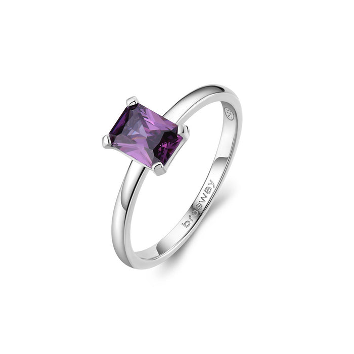 Silver ring with a purple gemstone on a white background