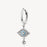 Silver hoop earring with a dangling eye charm on a white background