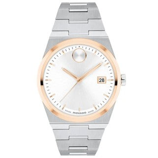 Silver and rose gold watch with white face on a white background