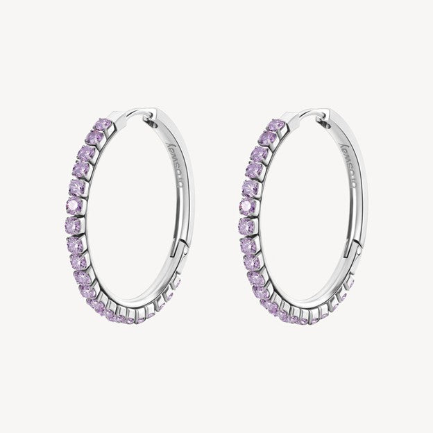 Silver hoop earrings with pink gemstones on a white background