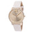 Gold watch with white strap on a white background
