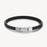 Black rubber bracelet with a silver clasp on a white background