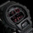 MENS black gshock military style digital watch. Digital time telling display with day date functionality, and stopwatch features. Face will light when button near the 6 oclock is pressed. Shock absorbant rubber strap and casing. Red detailing.