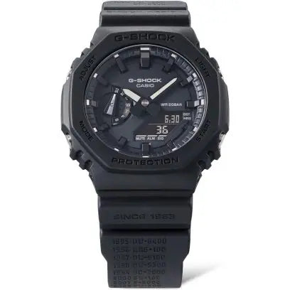 gentlemnans g-shock all black analog and digital. luminescent hands, digital clock with day date capabilities near the 5 oclock marker. shock-resistance casing and band.