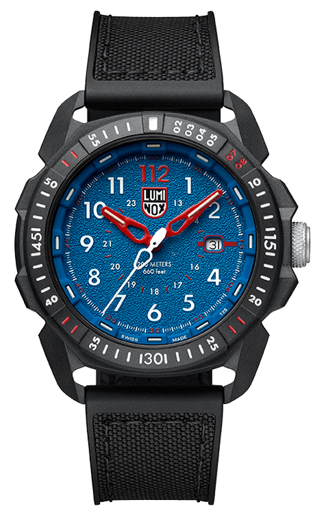 The black textured band and circular dial with second numerals and markers frame the face and accentuate the timekeeping ability of the piece. The numerals are easily readable and the white and red hands and markers create a theme with the blue face that is classy and unmistakable.