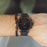 Men's MVMT Voyager Tundra, accented with gold markers, hour, minute and second hands on a balck dial. Dual chronographs with active time keeping features and a date wheel placed at the three o'clock marker. This watch casing sits between a black mesh stainless steel strap perfect for intricate sizing. 