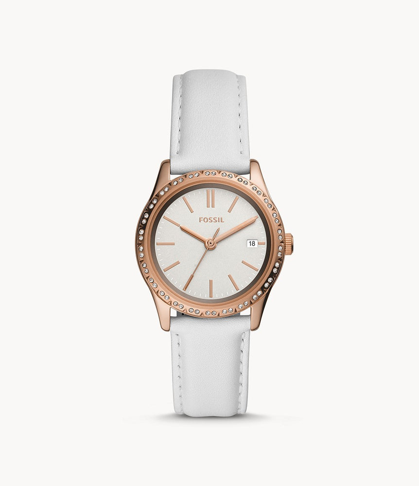 The smooth white leather strap attaches to the rose gold tone case and bezel. The rose gold tone stands out due to the matching rose gold hour markers and hands against the white face of the watch. The day date is also displayed.