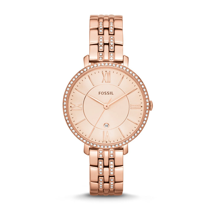 Rose gold-plated stainless steel case with a rose gold-plated stainless steel bracelet set with crystals. Fixed rose gold-plated bezel set with crystals. Rose dial with rose gold-tone hands and index hour markers. Roman numerals mark the 3, 6, 9 and 12 o'clock positions. Minute markers around the outer rim. Dial Type: Analog. Date display above the 6 o'clock position.