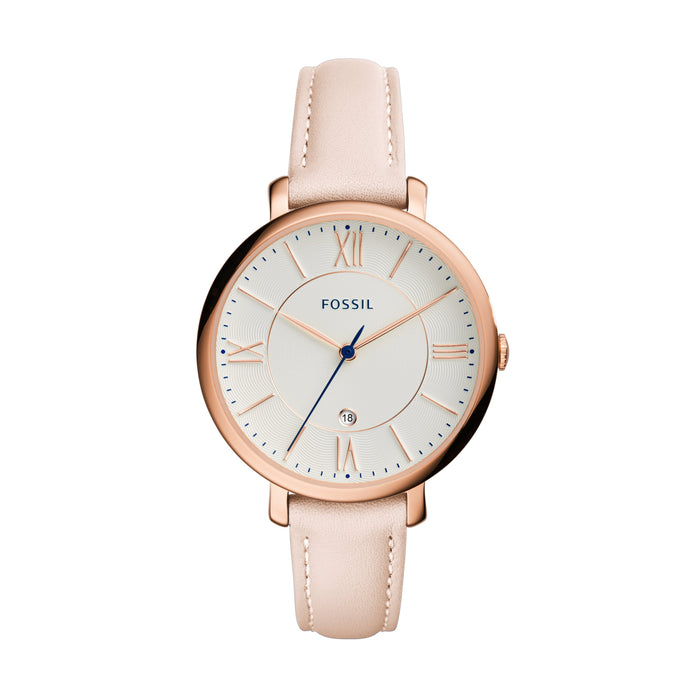 Rose gold-tone stainless steel case with a blush leather strap. Fixed rose gold-tone bezel. White dial with rose gold-tone hands and index hour markers. Roman numerals mark the 3, 6, 9 and 12 o'clock positions. Minute markers around the outer rim. Date display at the 6 o'clock position.