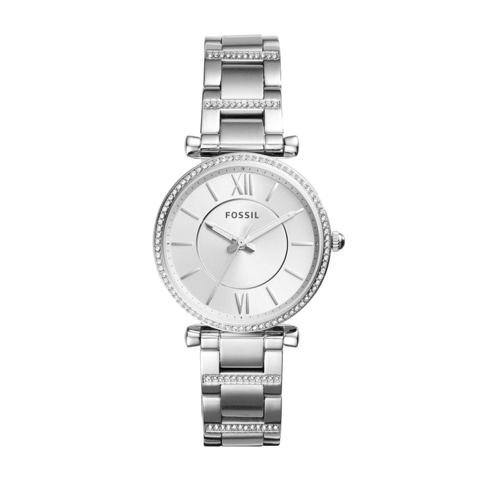 Silver-plated stainless steel case with a silver-plated stainless steel bracelet set with crystals. Fixed silver-plated bezel set with crystals. White dial with silver-tone hands and index hour markers. Roman numerals mark the 3, 6, 9 and 12 o'clock positions. Minute markers around the outer rim. Date display above the 6 o'clock position.