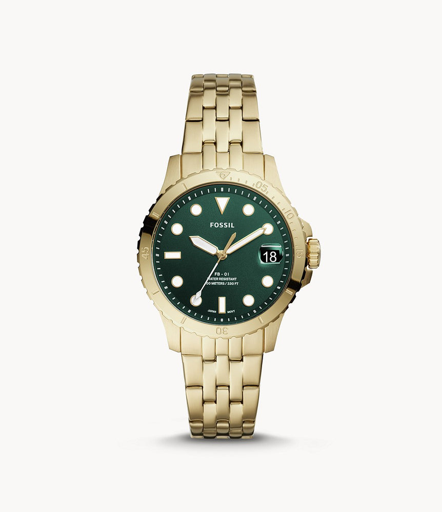 Yellow gold-tone stainless steel case and bracelet. Fixed yellow gold-tone bezel. Green dial with luminous yellow gold-tone hands and dot hour markers. Minute markers around the outer rim. Dial Type: Analog. Luminescent hands and markers. Date display at the 3 o'clock position.