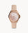 This delicate piece is blush and rose gold. The light pink leather strap attaches to the metallic case and bezel that frames the opalescent dial. The monochrome aesthetic with differing finishes adds details that subtly demand attention on the wearer.