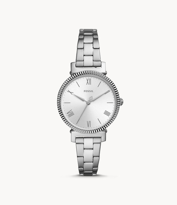 The tapered silver tone stainless steel bracelet attaches to the thin silver bezel with texture. The silver monochromatic aesthetic continues in the face and accessories of the watch. The slim Roman numerals and hands remain delicate.