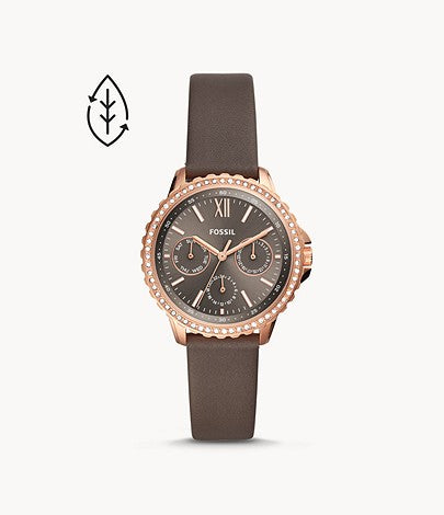 This piece features a unique taupe leather strap that attaches to the gold and crystal lined bezel. The face of the watch matches the unique shade of the leather strap and has lighter colored hour markers and hands as well as 3 matching sub dials.