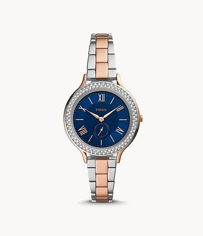 The two tone stainless steel bracelet attaches to the matching case and crystal lined bezel. The flat navy blue face contrasts the light color and allows the gold tone Roman numerals and hands to be easily readable.