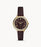The dark brown leather strap attaches to the complimentary gold tone stainless steel case and crystal lined bezel. The chocolate brown face features slim gold tone Roman numerals and hands as well as a matching sub dial.