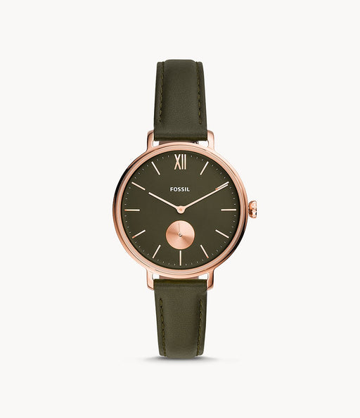 This piece features a slim green leather strap that attaches to a slight rose gold tone case and bezel that frames a green face with rose gold accents.