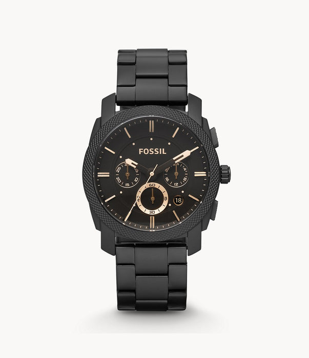 Fossil Men's Machine Quartz Chronograph, Three Hand Dial.  This minimalist Men's matte black, black plated textured bezel is accompanied with a dark brown dial and gold accented markers. Date wheel is placed in between the 4 and 5 o'clock markers. The dial measures at 45mm and is water resistant to 5 ATM (50 meters).