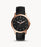 The rose gold tone stainless steel case and black leather strap frame the black face of the watch. The slight white hour markers and hands provide contrasting colors and easy readability while maintaining the very minimalist aesthetic.