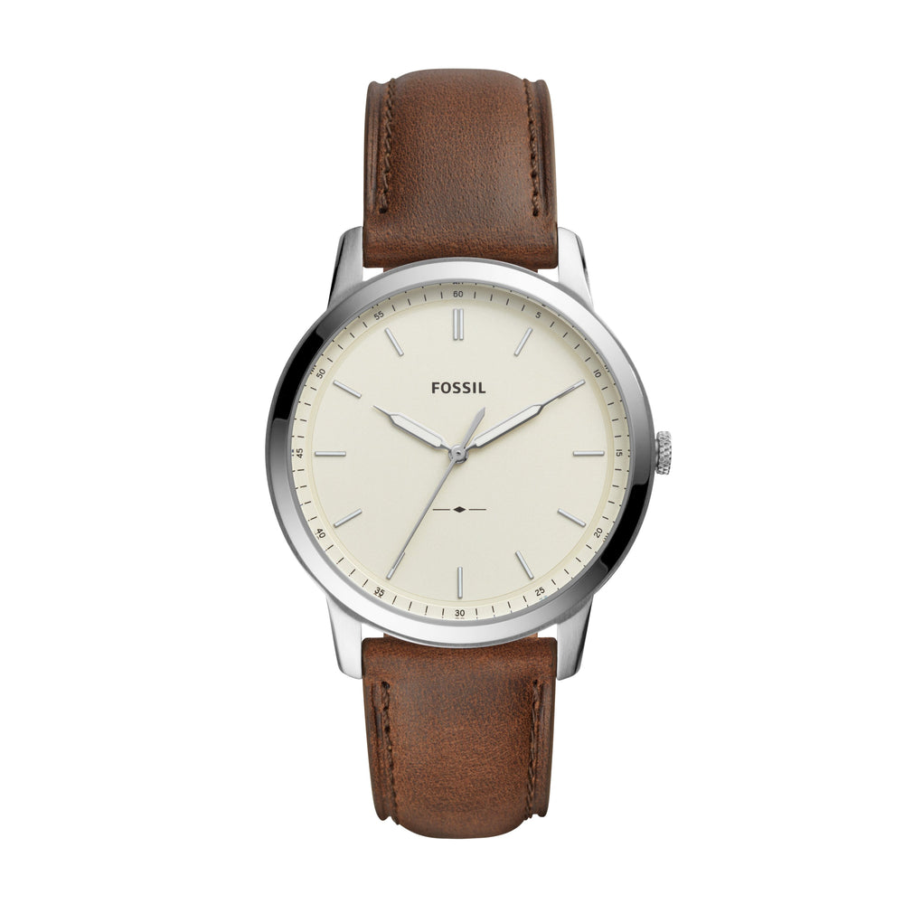 Stainless steel case with a brown leather strap. Fixed stainless steel bezel. Cream dial with luminous silver-tone hands and index hour markers. Minute markers around the outer rim.