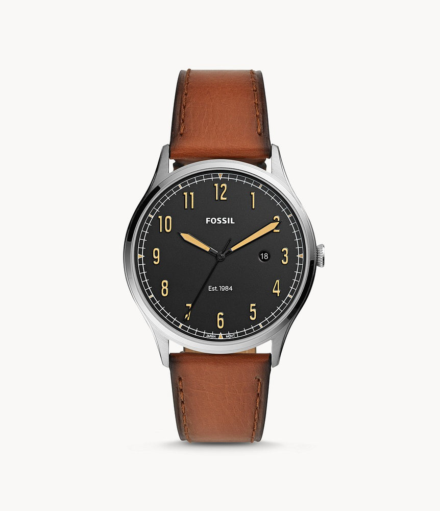 This Men’s Quartz Chronograph Forrester model has a smooth brown leather strap with darkened edges that attach to a silver toned stainless steel case. The dial is matte black with deep yellow hour numerals and minute and hour hands to match. The second hand is a glossy black and the date wheel is placed at the 3 o’clock marker. Encased in a 42MM dial, this watch is water resistant to 5ATM.