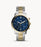 Stainless steel case with a two-tone (silver-tone and yellow gold-tone) stainless steel bracelet. Fixed yellow gold-tone bezel. Blue dial with luminous yellow gold-tone hands and index hour markers. Arabic numeral minute markers (at 5 minute intervals). Minute markers around the outer rim.