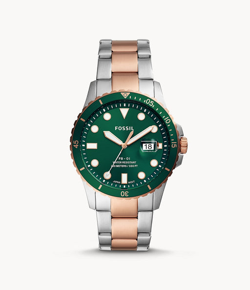 Stainless steel case with a two-tone (silver-tone and rose gold-tone) stainless steel bracelet. Fixed rose gold-tone bezel with an inlaid green ring. Green dial with luminous rose gold-tone hands and dot hour markers. Minute markers around the outer rim. Dial Type: Analog. Luminescent hands and markers. Date display at the 3 o'clock position.