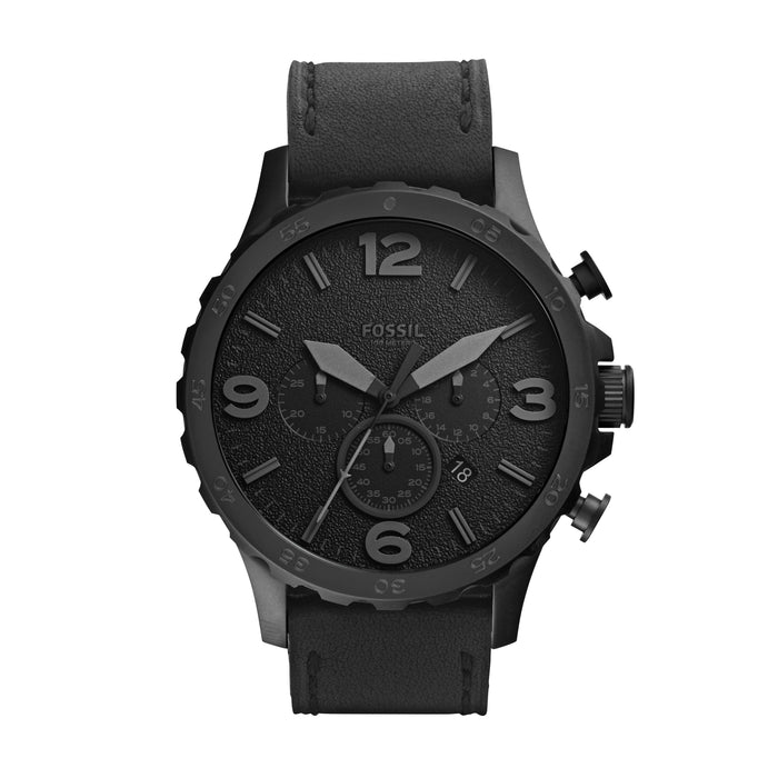 This all black timepiece creates a sophisticated aesthetic while the leather band with visible stitching gives a sense of casualness. The large 3, 6, 9, and 12 numerals are matte black against the textured black face. Although monochrome, the size and shape of the hands and numerals make for easy readability.