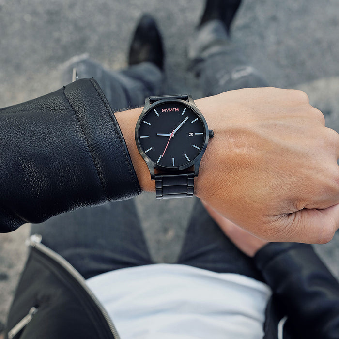 Men's Black Link MVMT 45MM Case. Black dial, Black hour and minute hands. red second hand and red MVMT logo placed at the 12 o'clock marker. Black Stainless steel casing and band.