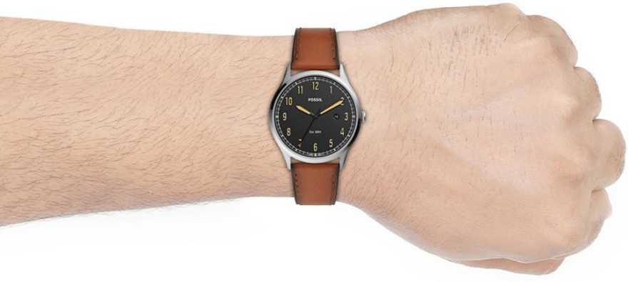 This Men’s Quartz Chronograph Forrester model has a smooth brown leather strap with darkened edges that attach to a silver toned stainless steel case. The dial is matte black with deep yellow hour numerals and minute and hour hands to match. The second hand is a glossy black and the date wheel is placed at the 3 o’clock marker. Encased in a 42MM dial, this watch is water resistant to 5ATM.