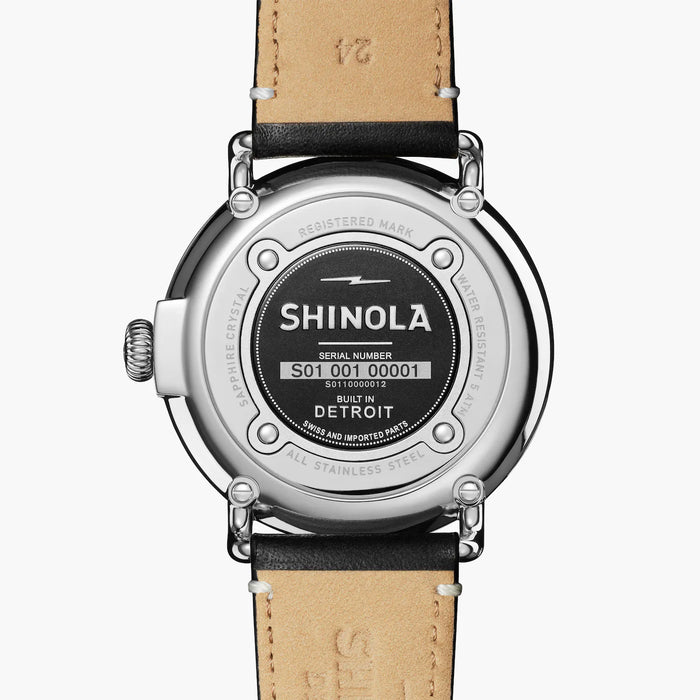 This Men's 47mm Shinola Runwell Chrongraph watch measures at 47mm with a case thickness of 12.3mm. White Numerical Markers are placed at all stations of the watch with a subdial at the 6 o'clock marker that works as a second hand. A black band is connected to this solid stainless steel case.