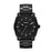 This bold, all black ensemble is eye catching and demands respect. The black stainless steel bracelet attaches to the large case and textured bezel of the watch. The face is sectioned off by thick white hour markers and white tipped hands.