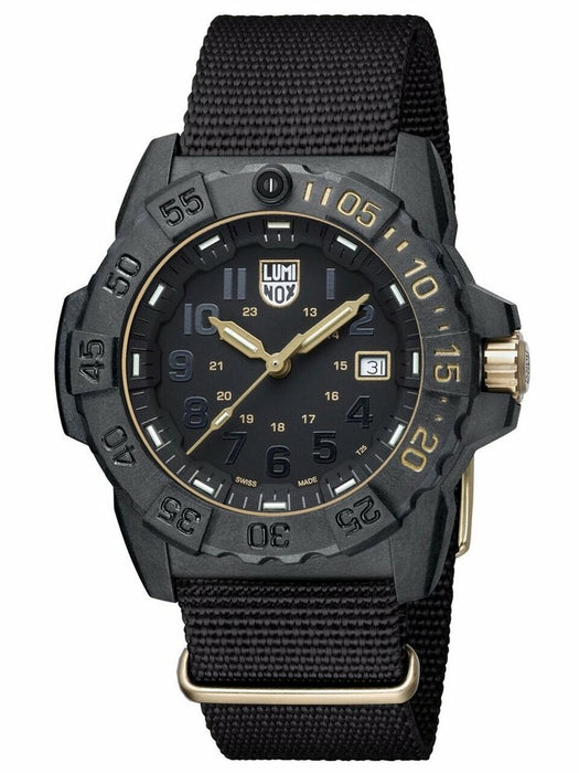 The black nylon strap continues the sleek and stealthy aesthetic of this timepiece. The matte black face with gold and black second numerals frames the inner dial with black hour numerals on a black background and gold hands that are subtle but impossible to miss.