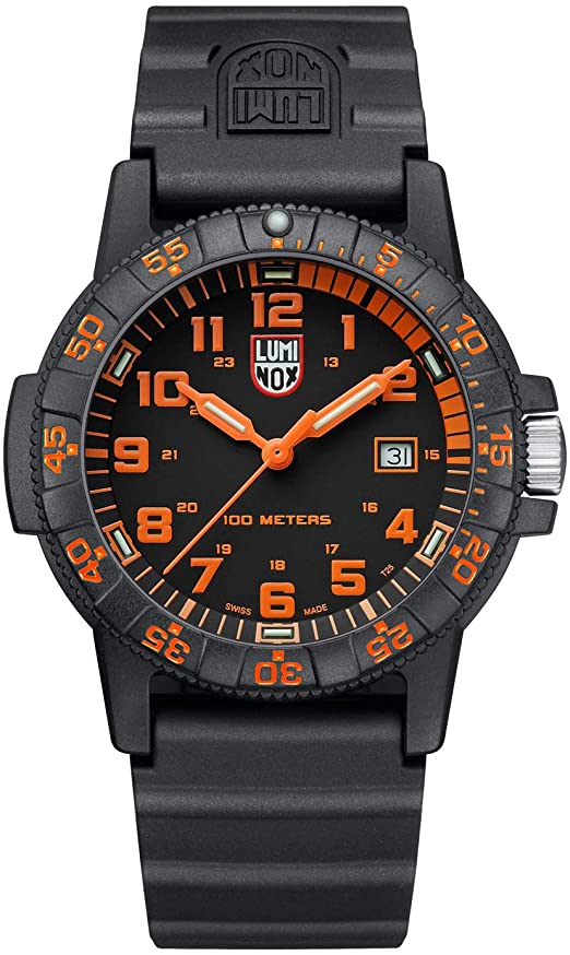 The nautical sea life theme of this watch is evident by the shape of this watch and the design of the band as well. The protected crown is like that of a turtle and the case is its shell, the small orange second numerals match the bold hour numerals and hands within the face of the watch. Overall an eye-catching color scheme with a timeless underlaying style. In darkness, the even hour markers and hands illuminate for maximum visibility.