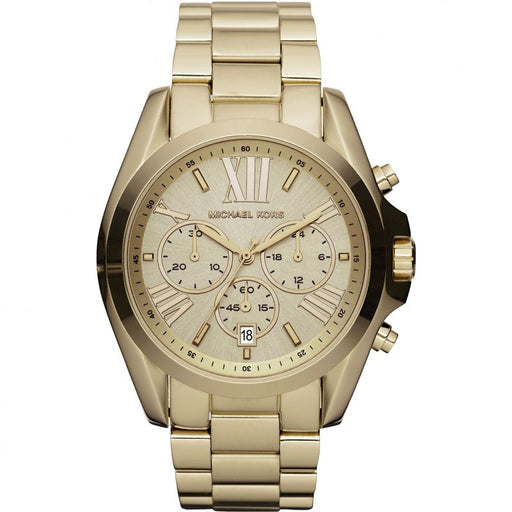 Ladies Model Bradshaw MK, All gold tone watch, champagne colored dial. Fully functional chronograph placed at the 3,6,9 markers, date wheel placed at the 6 oclock dial, partial roman numeral markers at the 12, 2, 4, 8, & 10.  